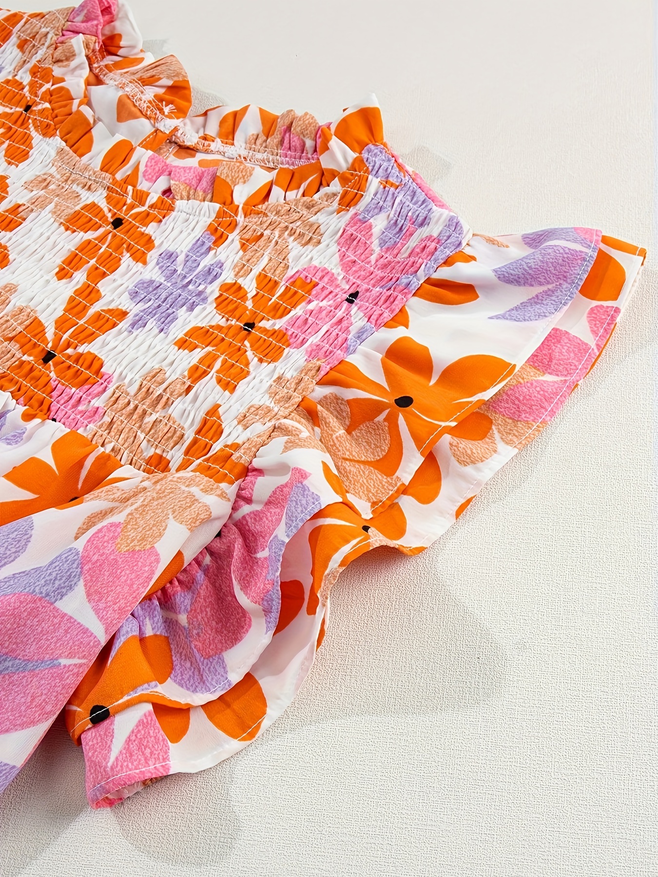 orange sleeve smocked floral top details 0