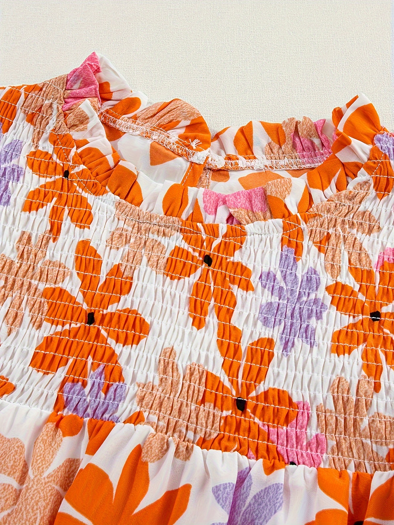 orange sleeve smocked floral top details 1